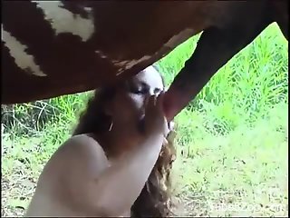 Hot bitch worships a horse's huge cock big time